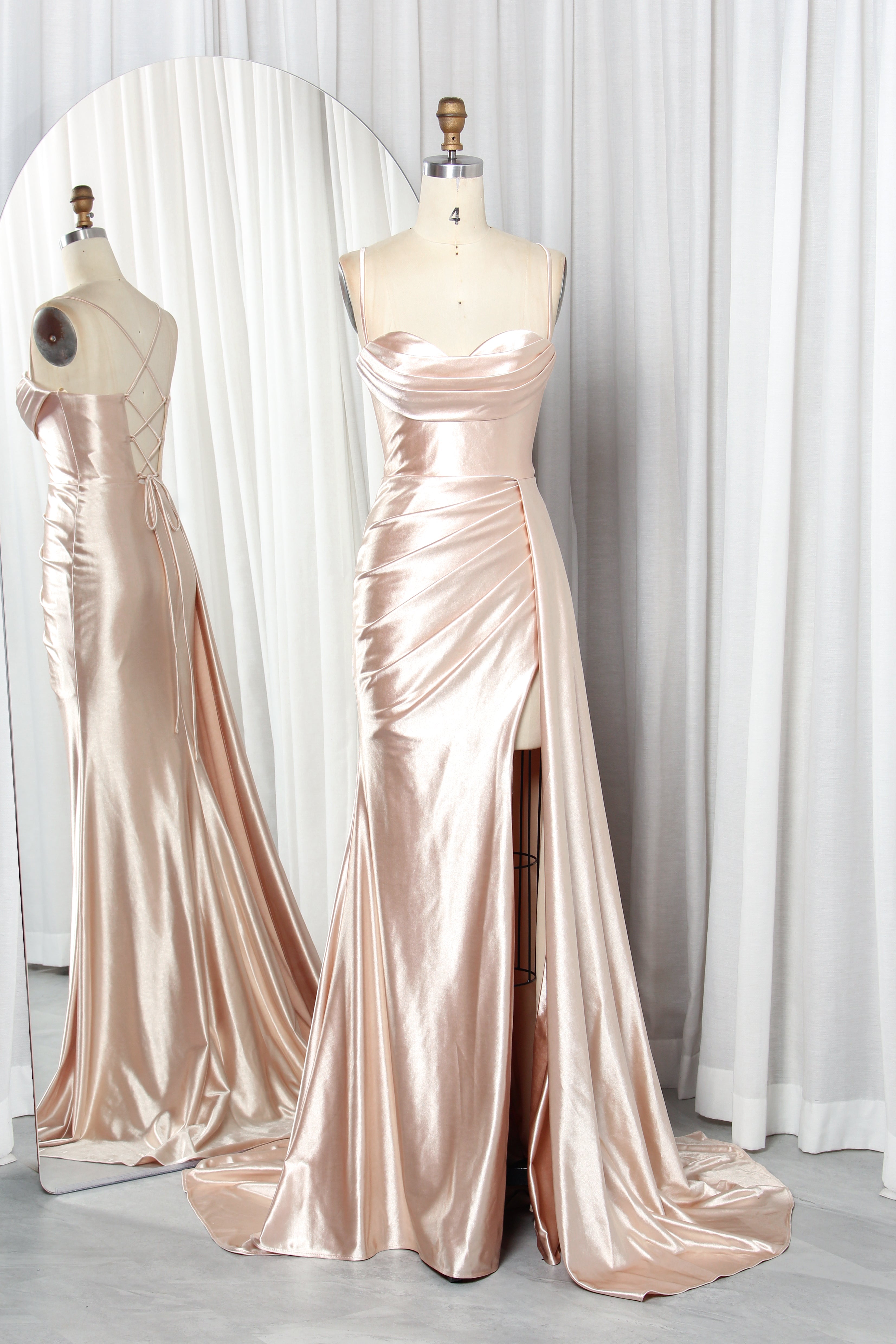 satin prom dress with spaghetti straps, a draped bodice, and a high slit.