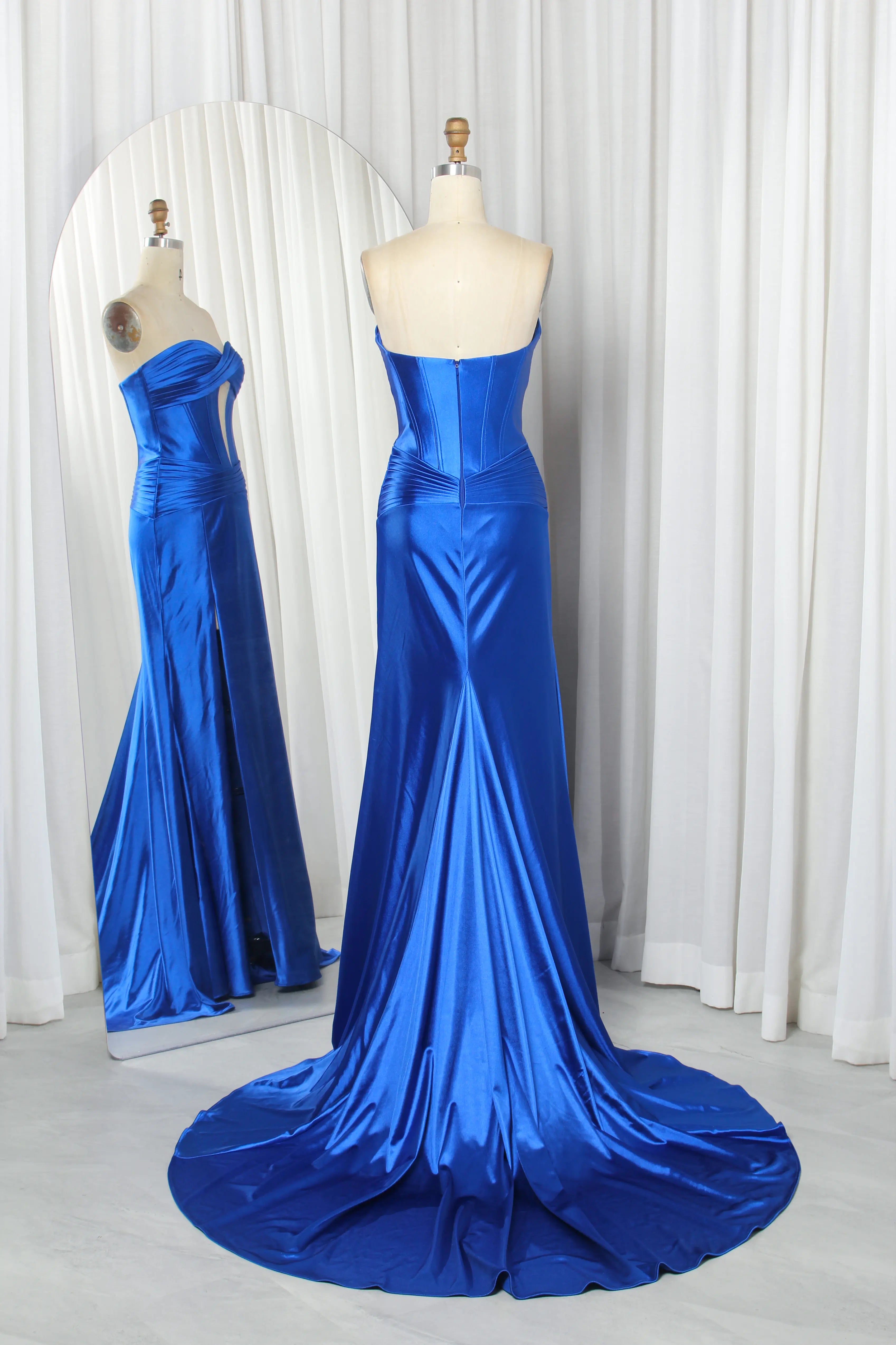 Royal blue satin strapless corset mermaid gown on mannequin with keyhole bodice