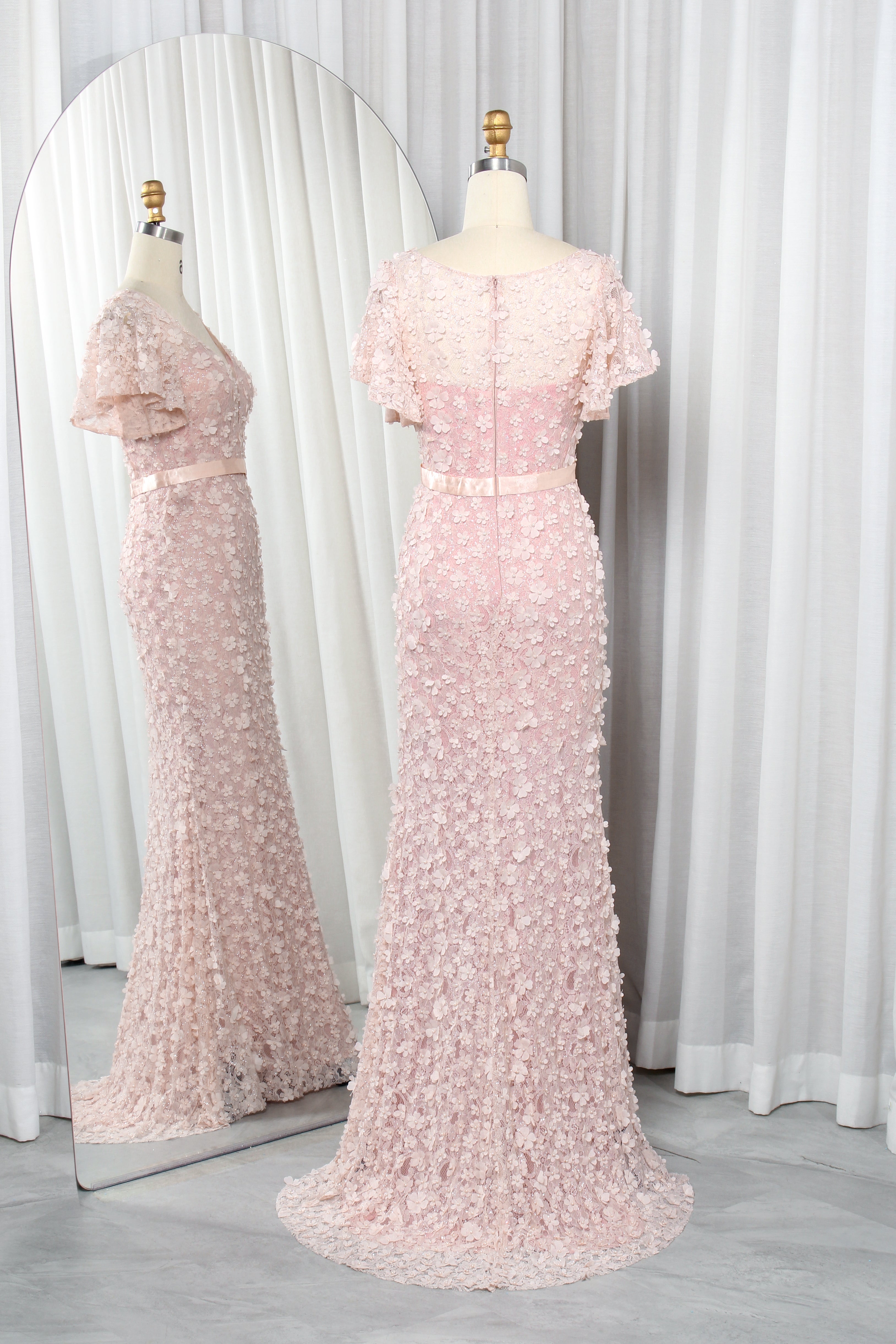 Pink V-neck mermaid gown with floral appliques, short sleeves, and fitted waist