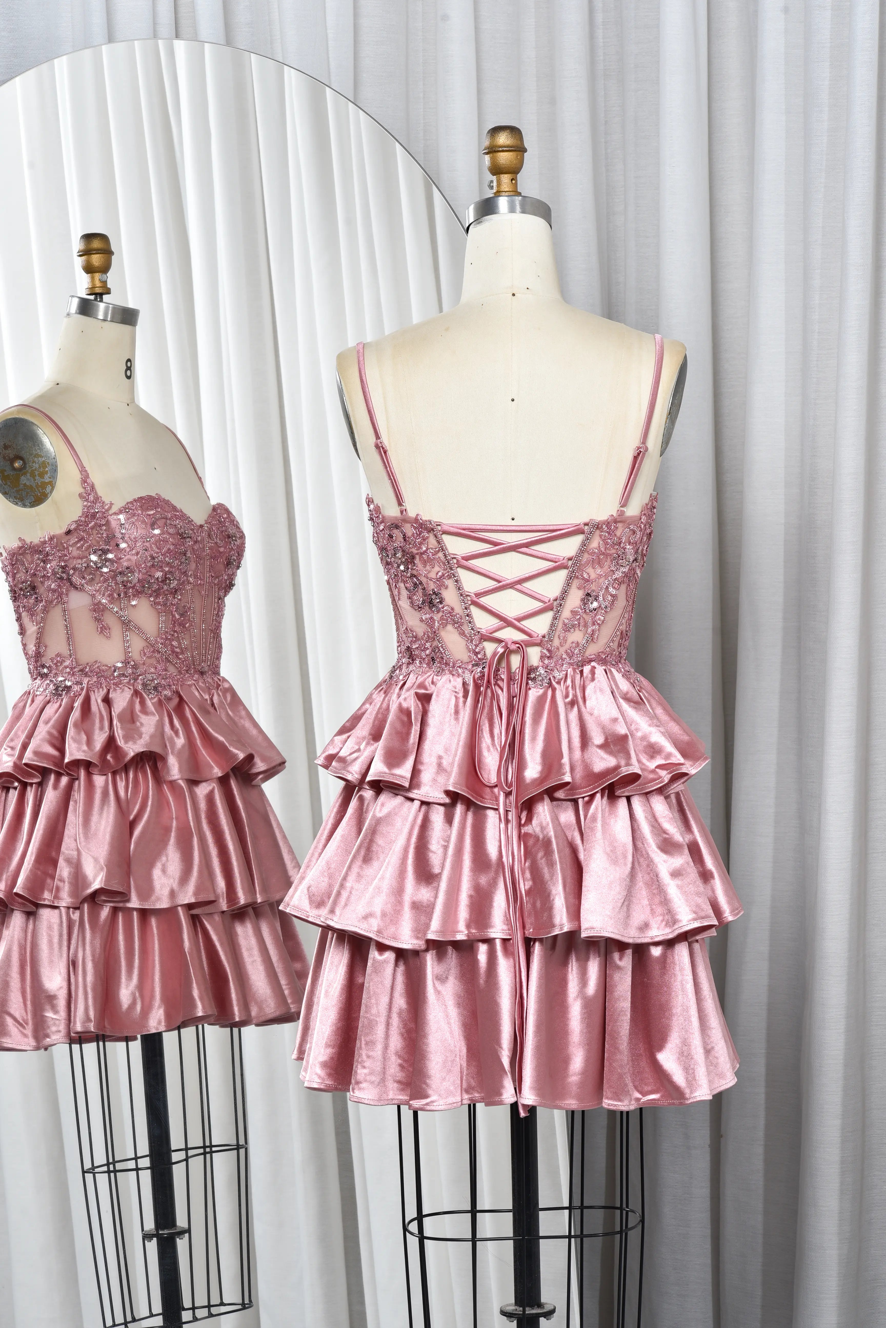 Pink sequin lace corset babydoll dress with crisscross tie-back and tiered satin ruffles