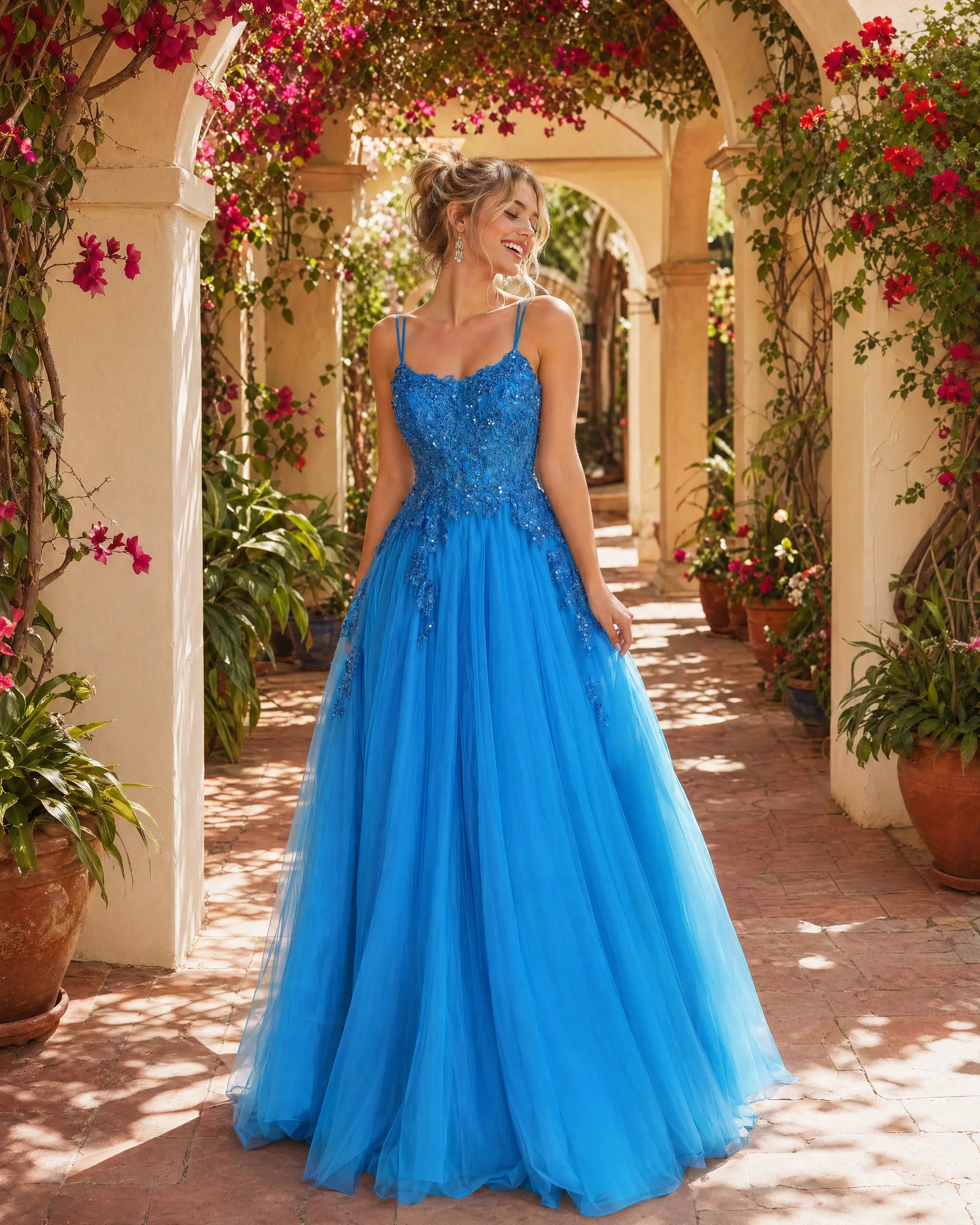 Blue A-line prom dress with double spaghetti straps and beaded lace bodice