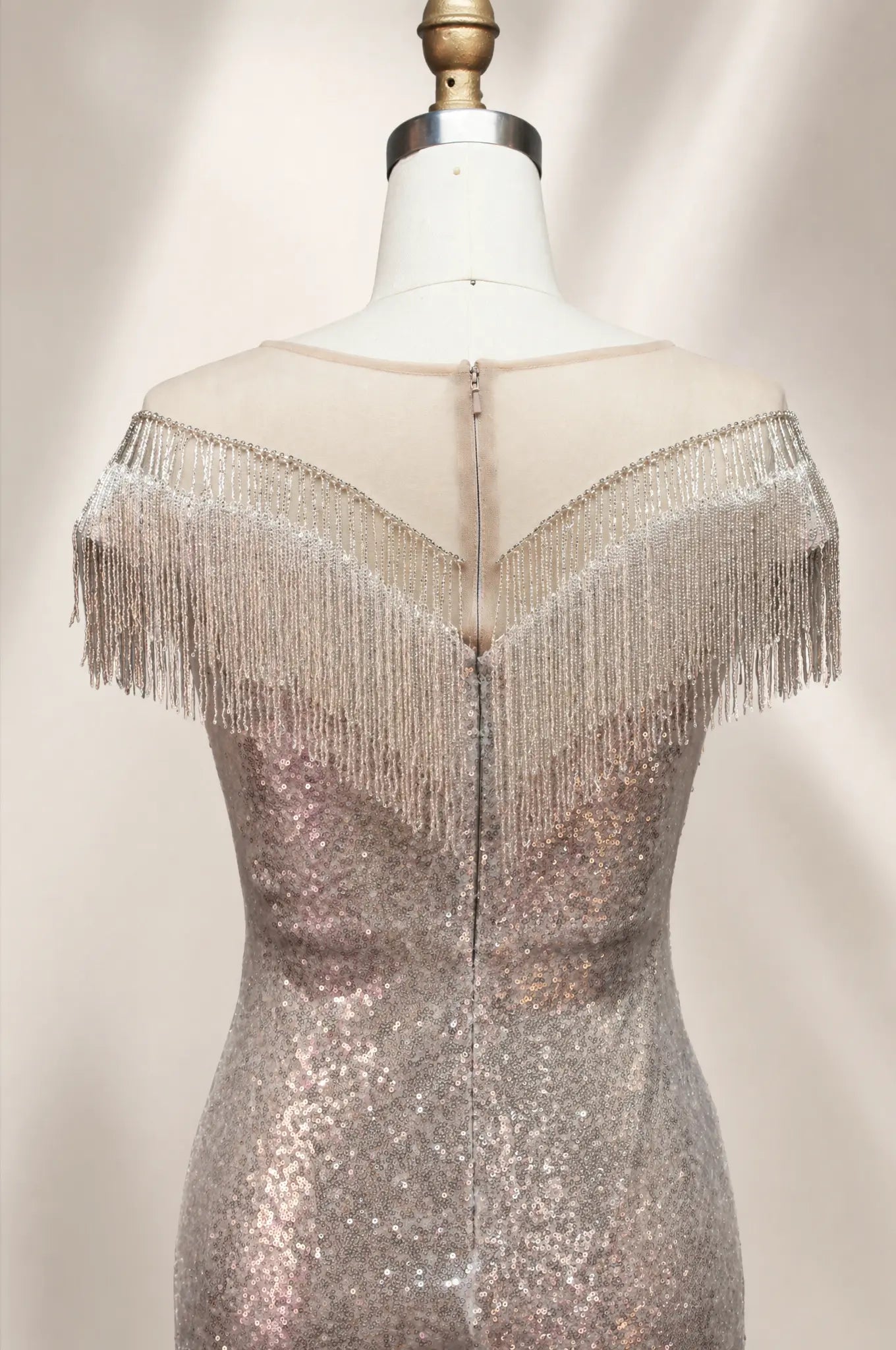 Silver sequin backless gown with fringe off-shoulder sleeves