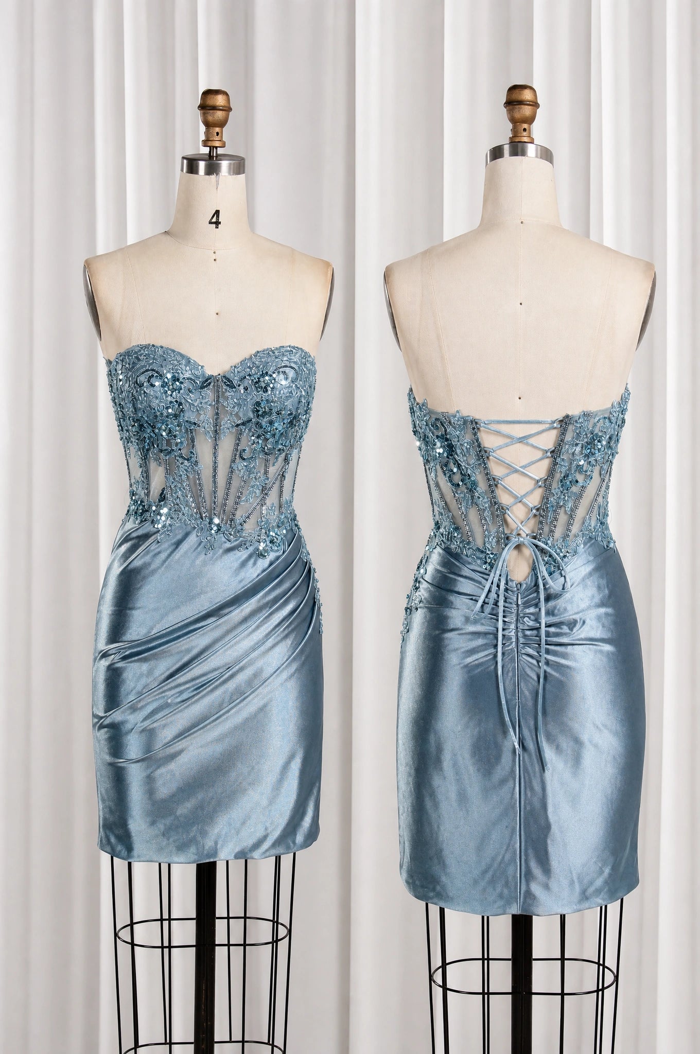 Dusty blue strapless homecoming dress on mannequins, lace corset front and lace-up back