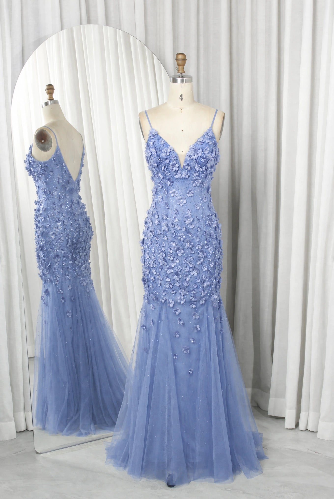 Dusty blue sequined mermaid prom dress on mannequins, V-neck and floral tulle skirt