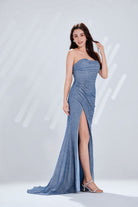 Steel blue glitter strapless evening gown with high slit.
