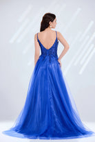 Back view of royal blue corset-style prom dress with spaghetti straps and glitter tulle skirt