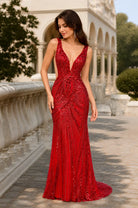 Red sequined sleeveless V-neck evening gown with fitted mermaid skirt