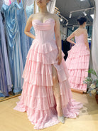 Structured corset tiered ruffle ball gown in light pink with sweetheart lace neckline.