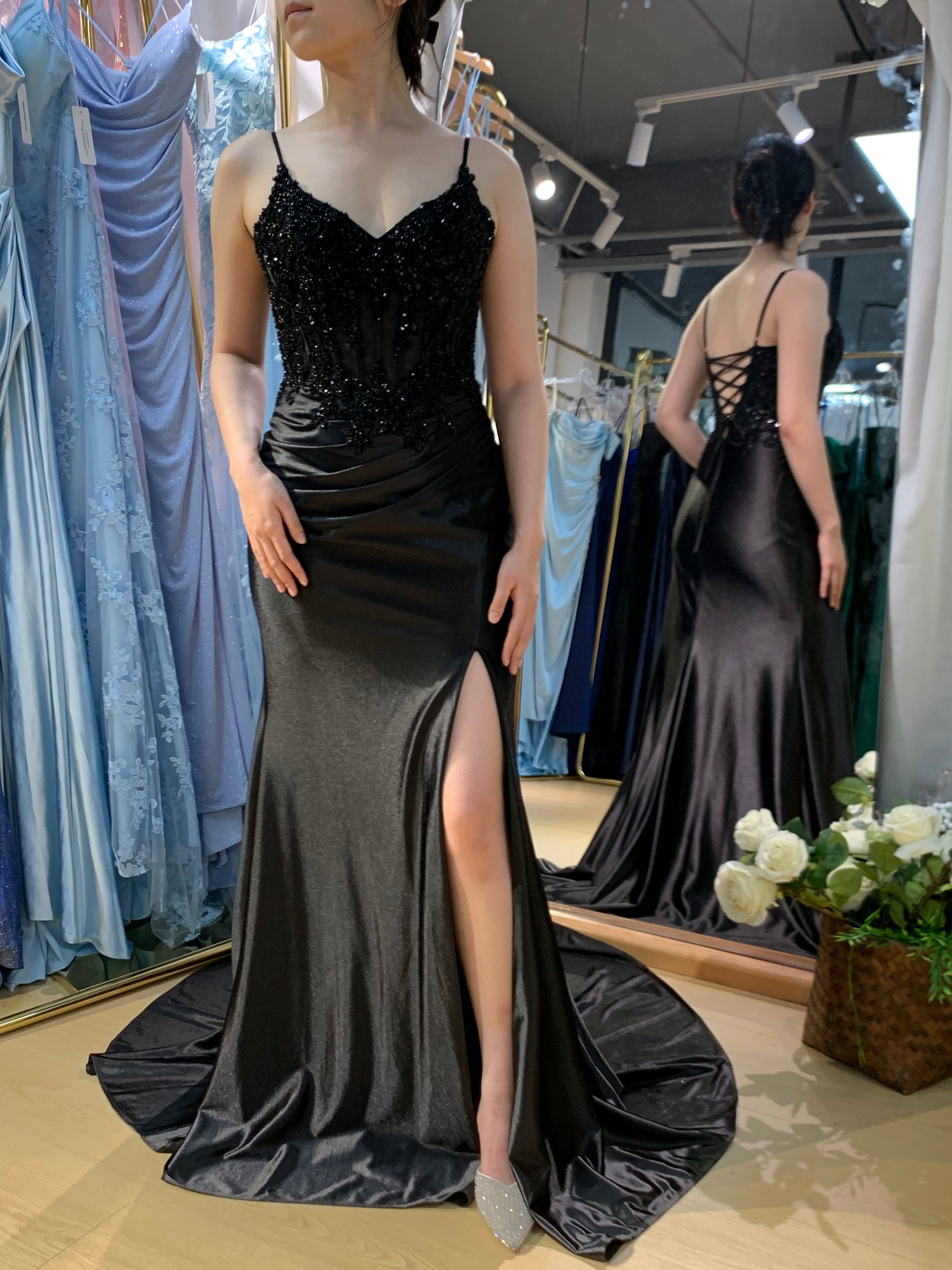 Black satin corset prom gown with beaded lace-up bodice, V-neck, and front slit
