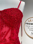 Red lace corset bodice with beaded floral applique and thin spaghetti straps