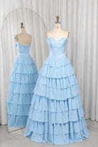 Sky-blue strapless tiered ruffle ball gown with corset-style bodice and fitted waist.