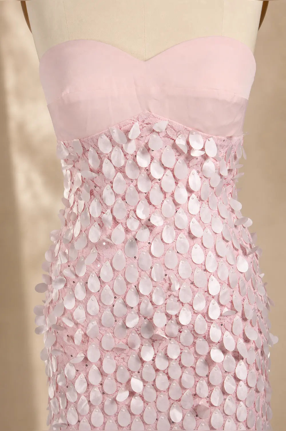 Pink textured bodice with petal sequin overlay and corset fit