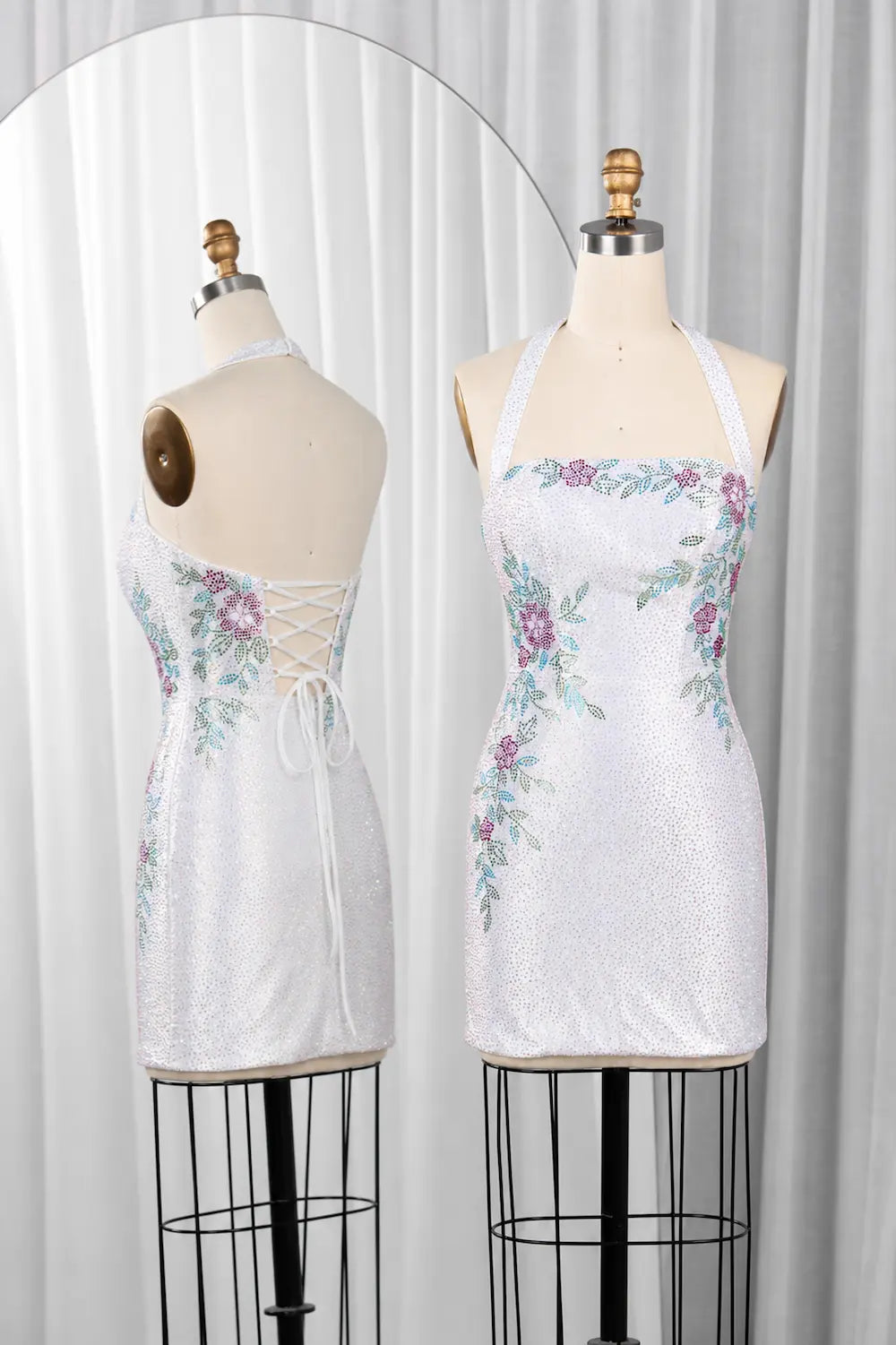 White sequin mini dress with floral rhinestones, spaghetti straps, lace-back