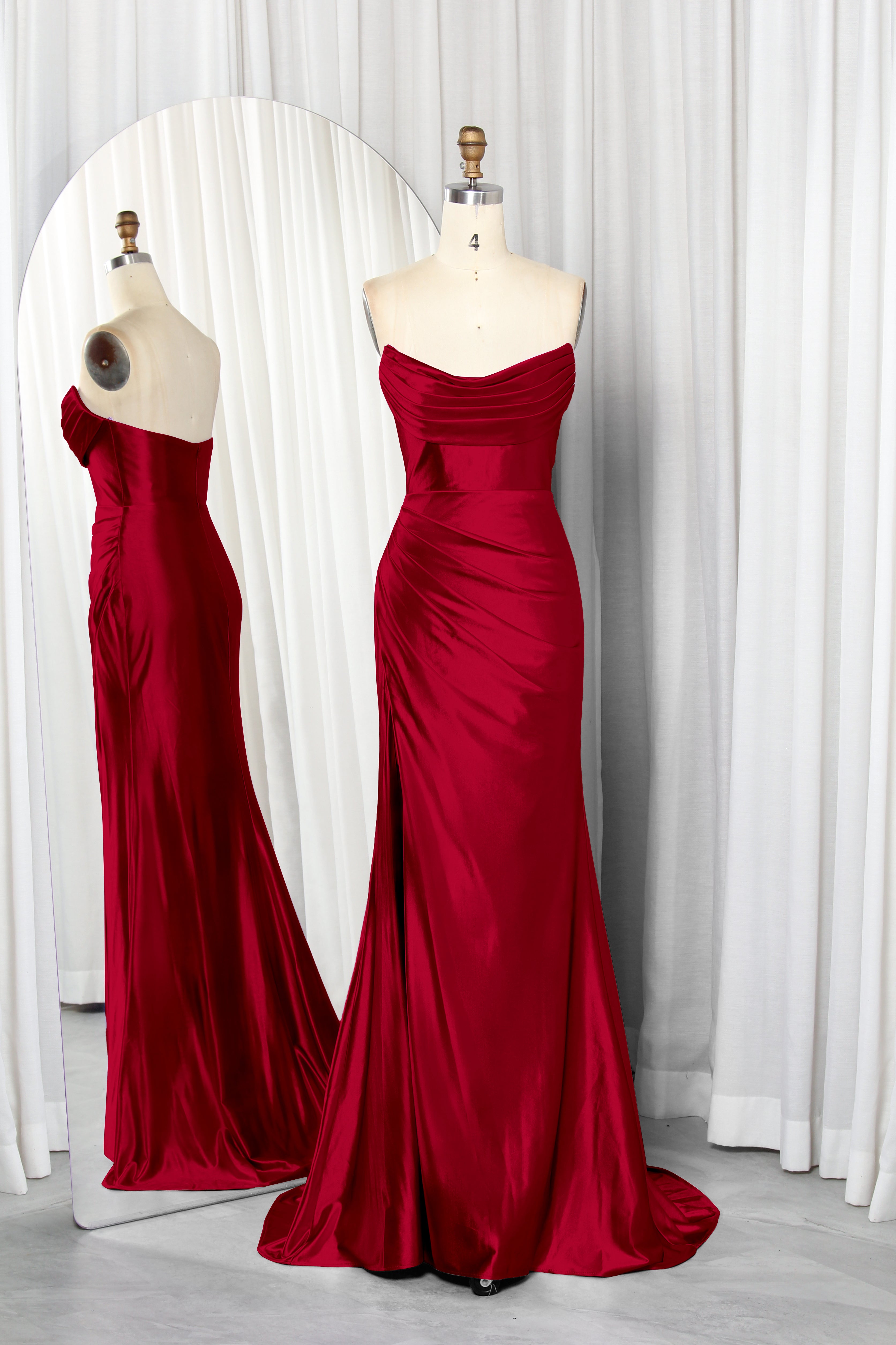 strapless satin dress with a draped bodice and high slit.