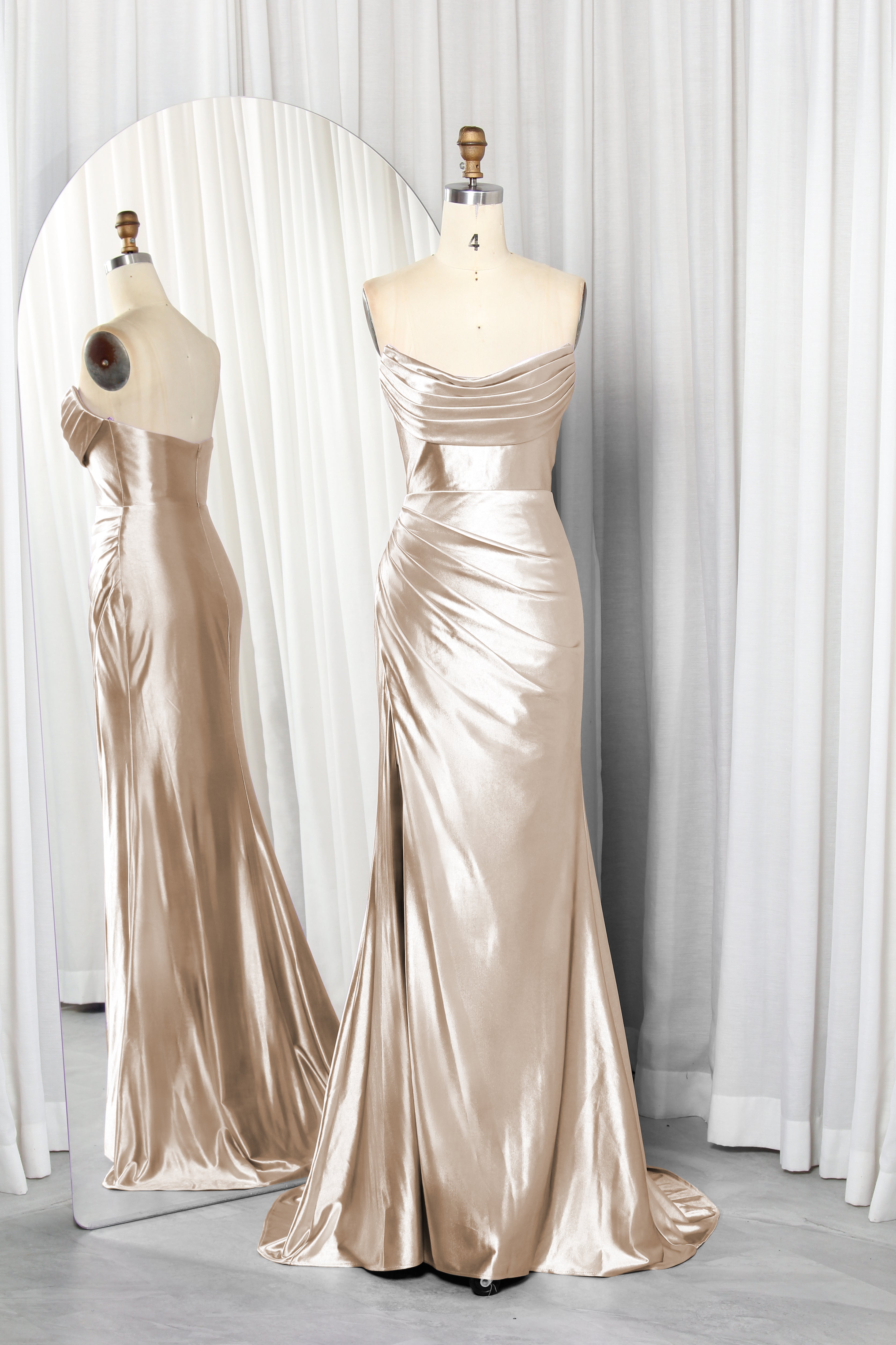 strapless satin dress with a draped bodice and high slit.