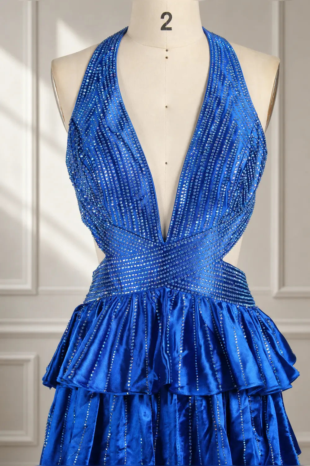 Royal blue halter maxi dress with deep V neckline and glittery tiered ruffles