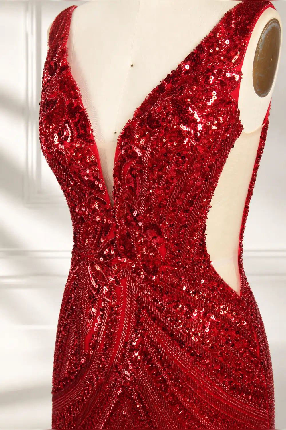 Red sequin V-neck bodice detail with open back and sparkling beadwork