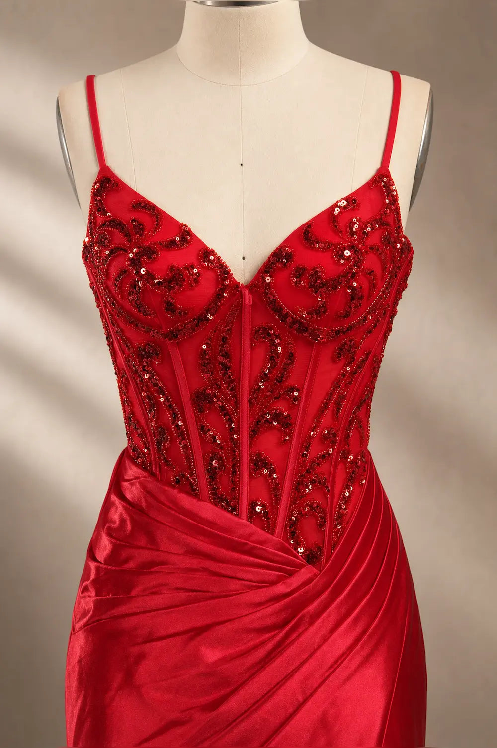 Red sequin corset gown with spaghetti straps and ruched satin skirt