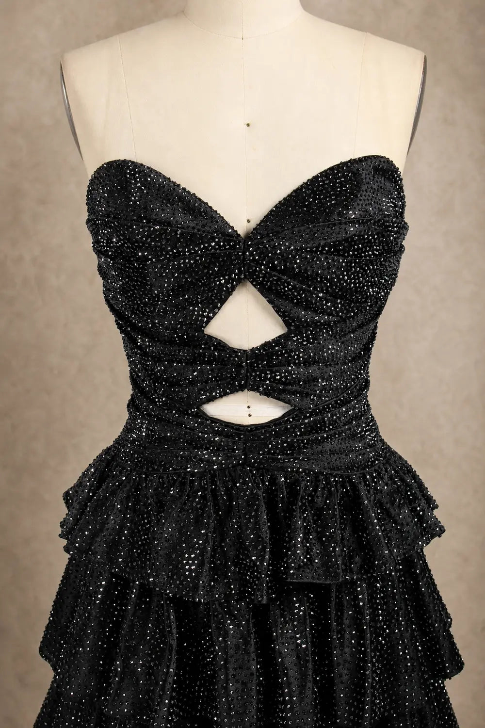 Black sequin corset mini dress with large bow and keyhole cutout