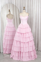 Pink strapless tiered ruffle ball gown with corset-style bodice, fitted waist.