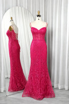 Hot pink mermaid corset prom dress with lace texture and thin straps