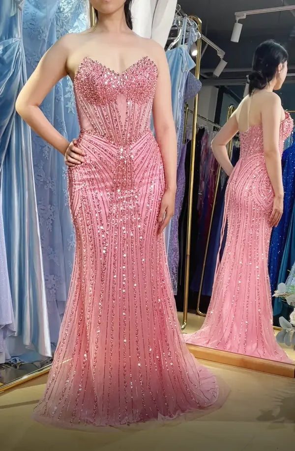 Pink beaded corset-style mermaid prom dress with sweetheart neckline and spaghetti straps