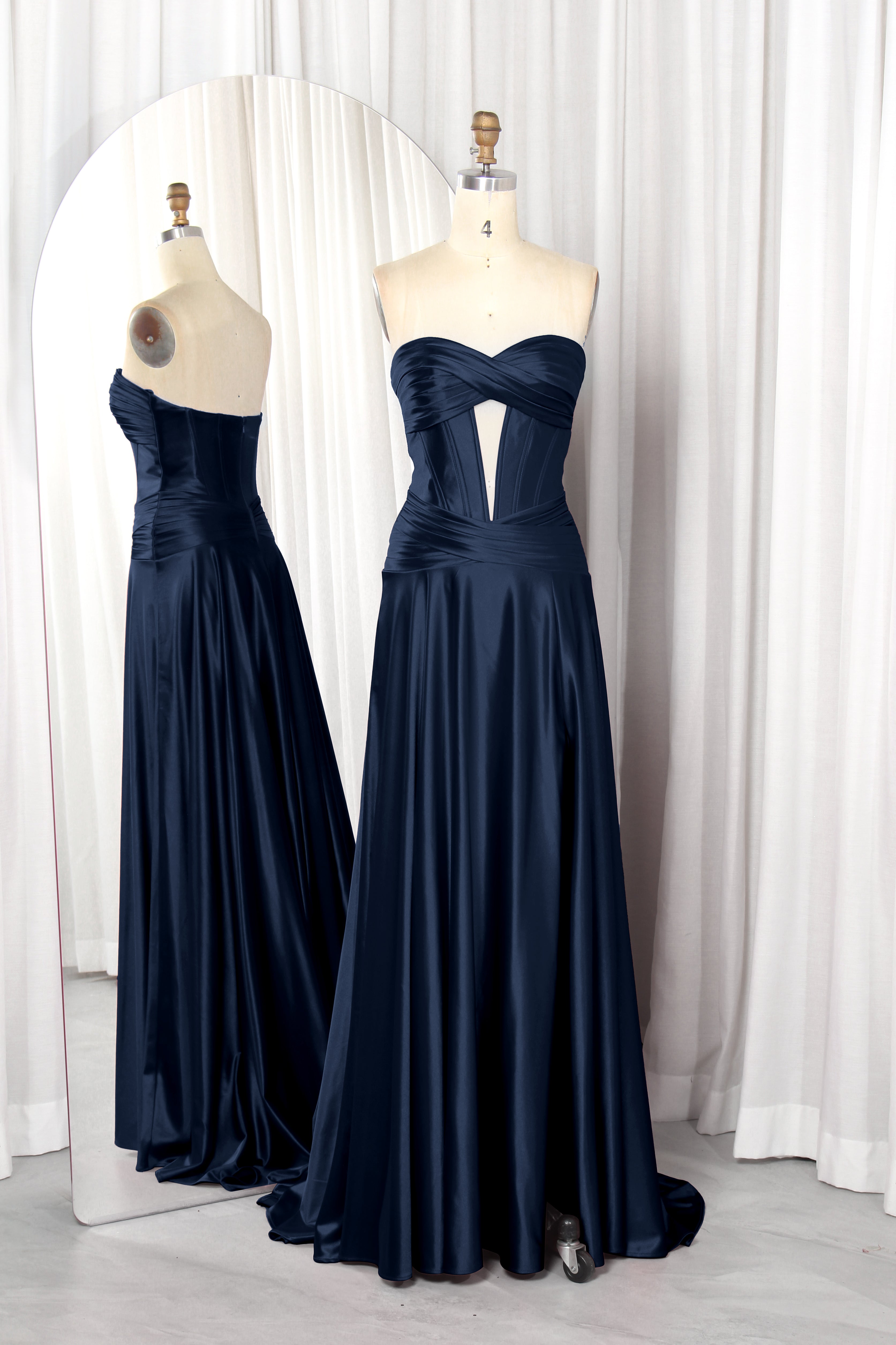 strapless satin prom dress with a front cutout and high slit.