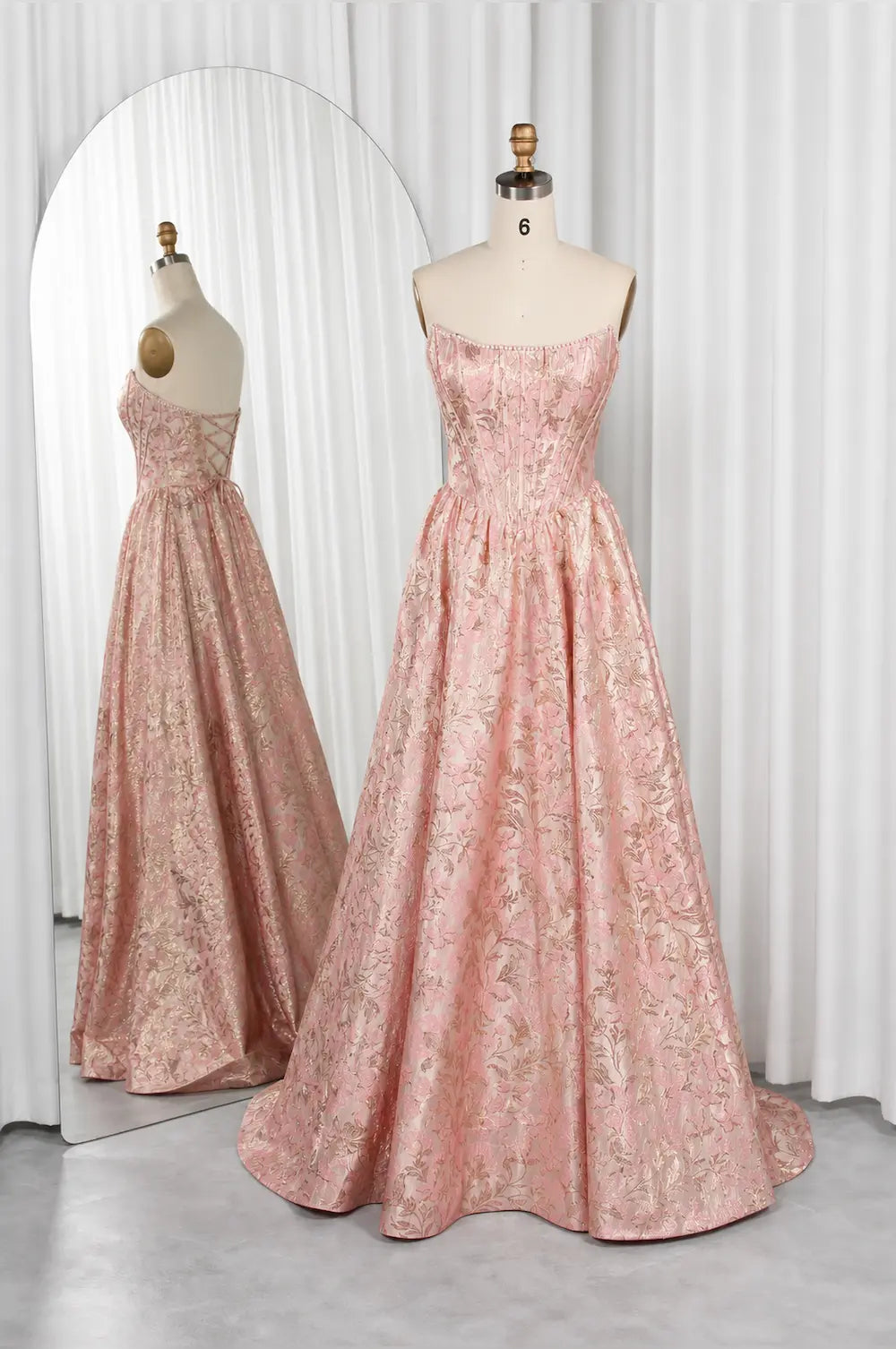 Pink floral maxi dress with square neckline, thin straps, and full skirt
