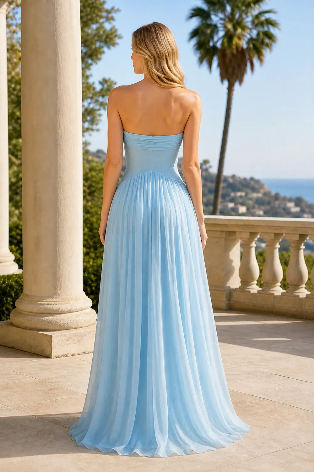 Sky blue strapless maxi dress with back ruching and flowing pleated skirt