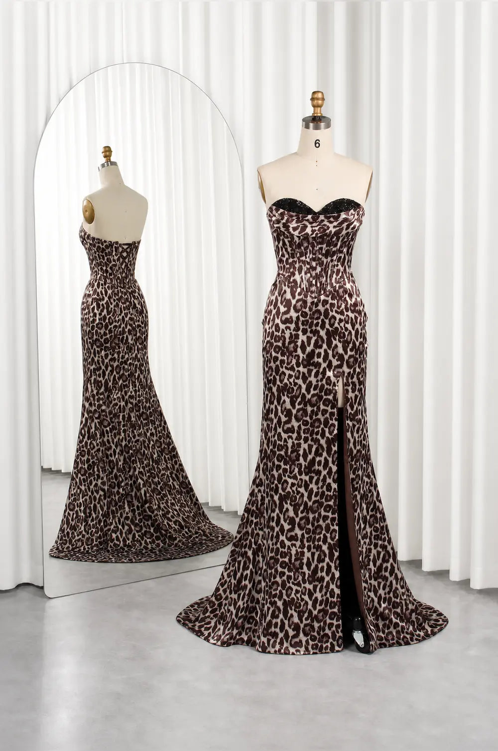 Leopard print maxi dress on mannequins with bustier bodice and flared skirt