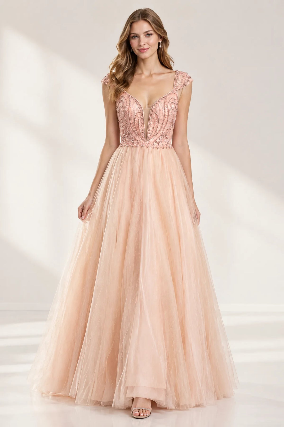 Peach A-line prom dress with beaded bodice and flowing tulle skirt, cap sleeves