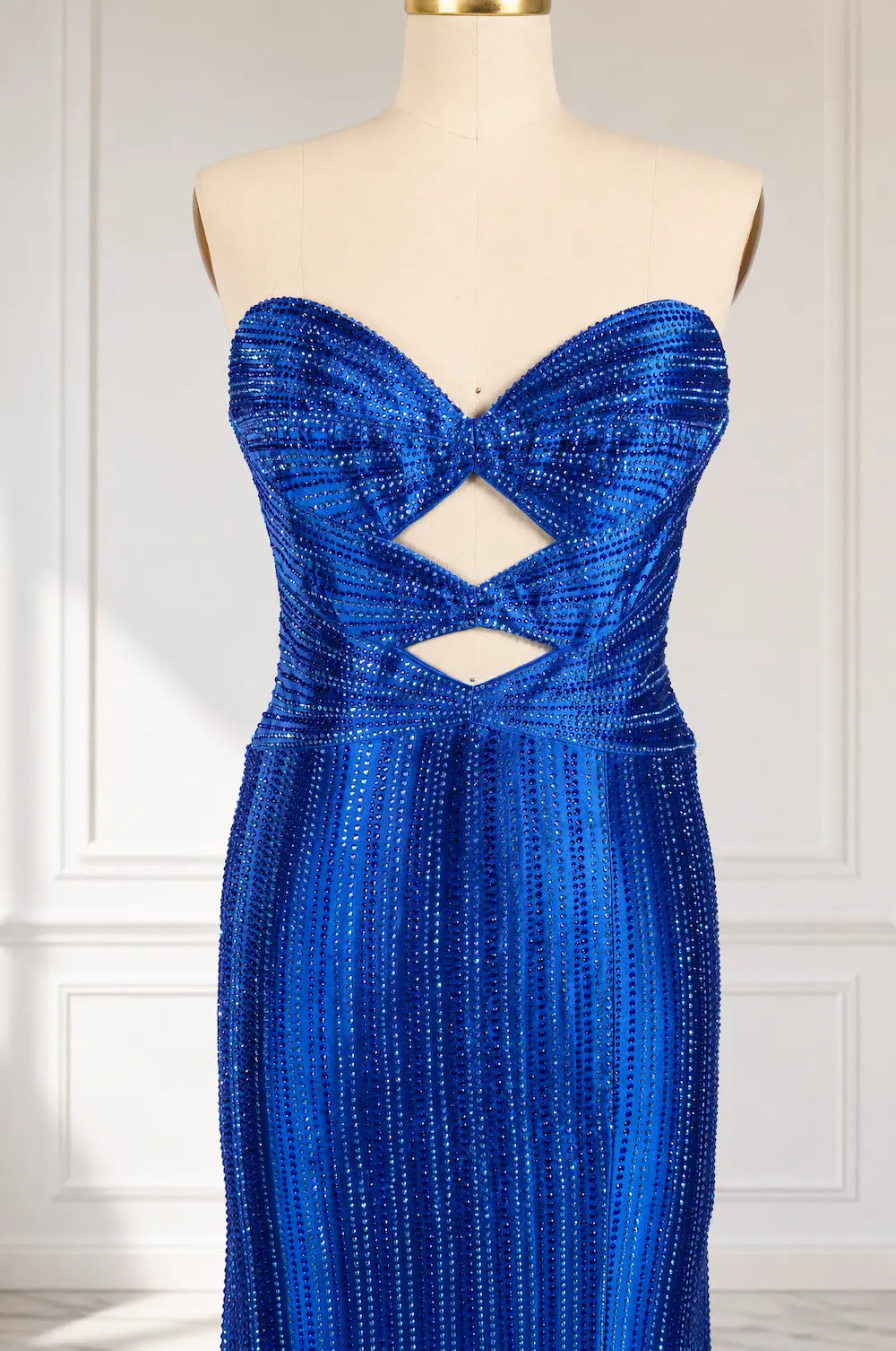 Royal blue sequin strapless gown with crisscross cutout bodice
