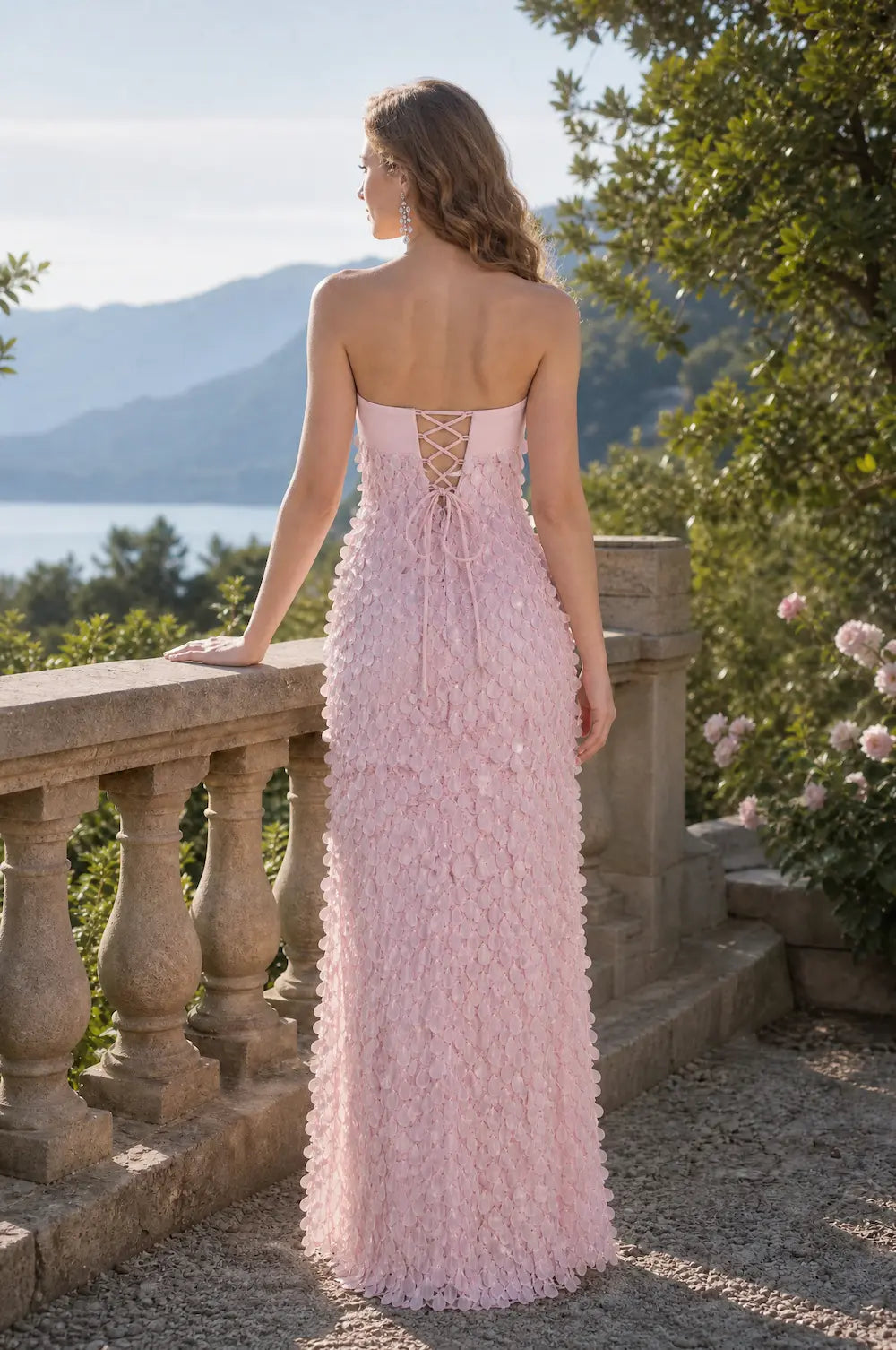 Pink textured maxi dress with open back and lace-up crisscross straps