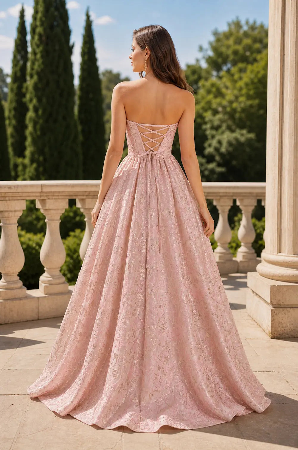 Pink corset-back A-line dress with thin straps and full flowing skirt
