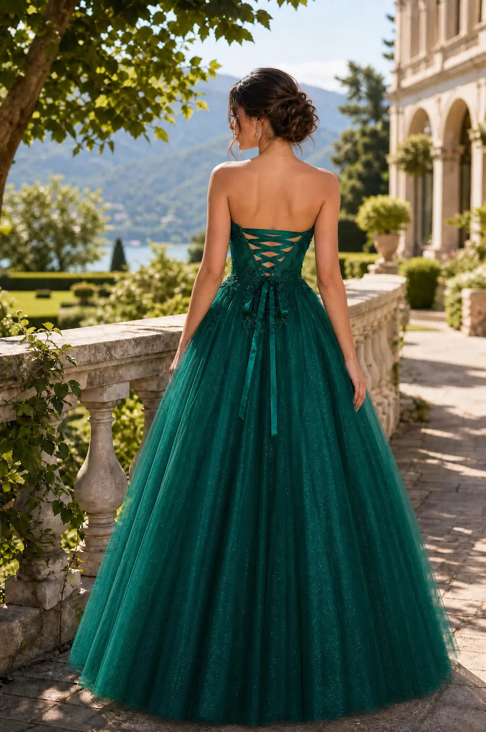 Emerald strapless lace ball gown with open-back corset detail and full tulle skirt