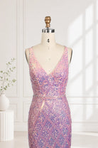 Iridescent pink sequin mermaid prom dress on mannequin with V-neck fitted bodice