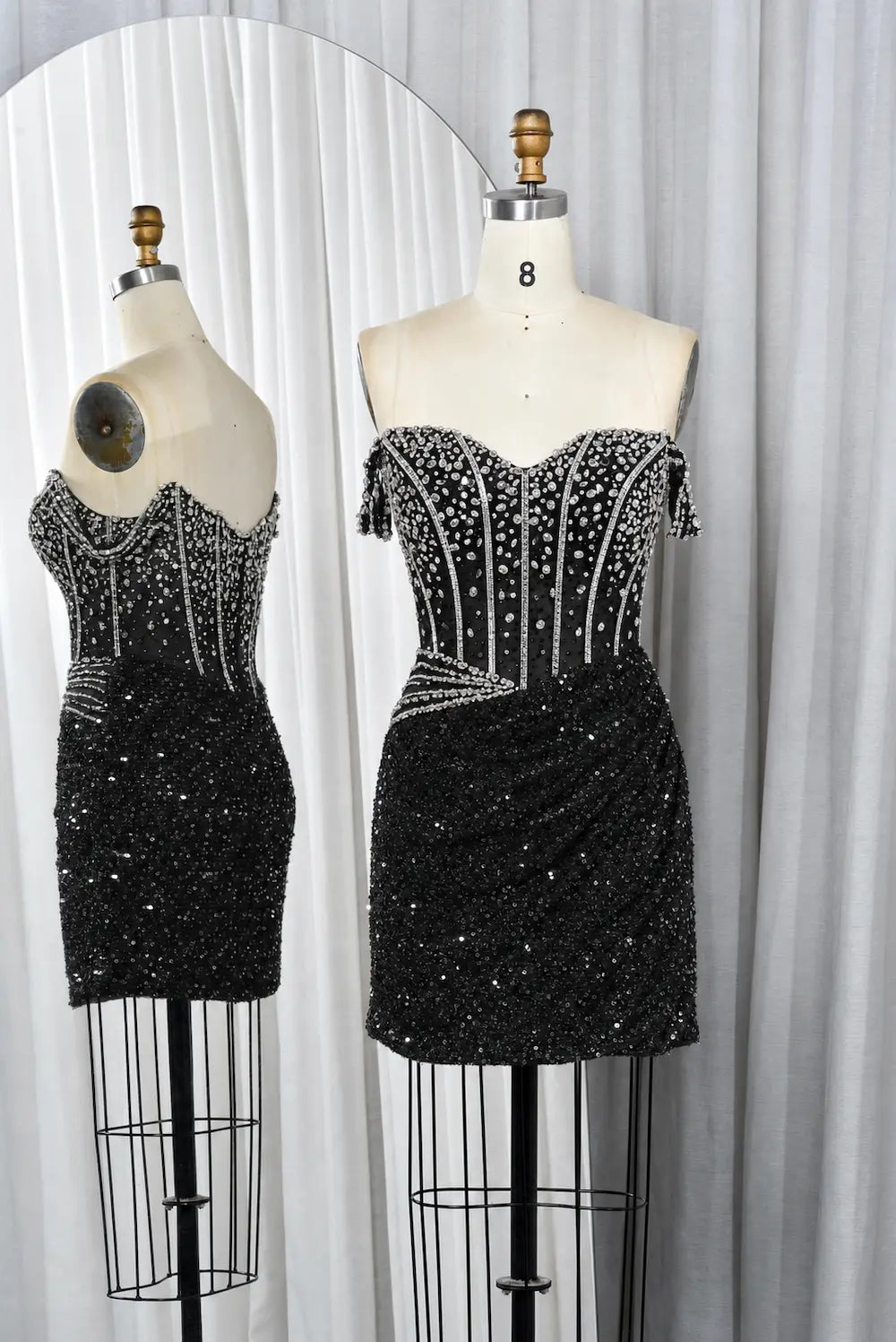 Black sequin mini dress with off-shoulder beaded corset bodice and ruched skirt