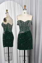 Emerald green sequin mini dress with off-shoulder beaded corset bodice and ruched skirt