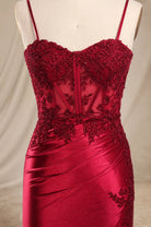 Wine red corset-style bodice dress with embroidered lace details and spaghetti straps