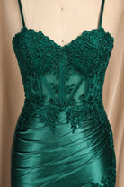 Emerald green beaded lace corset bodice with thin straps and ruched satin waist