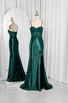 Emerald green satin evening gown on mannequin, lace corset with thin spaghetti straps