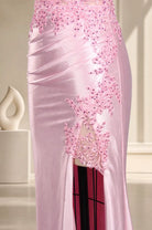 Pink satin mermaid evening dress with floral beadwork and draped bodice