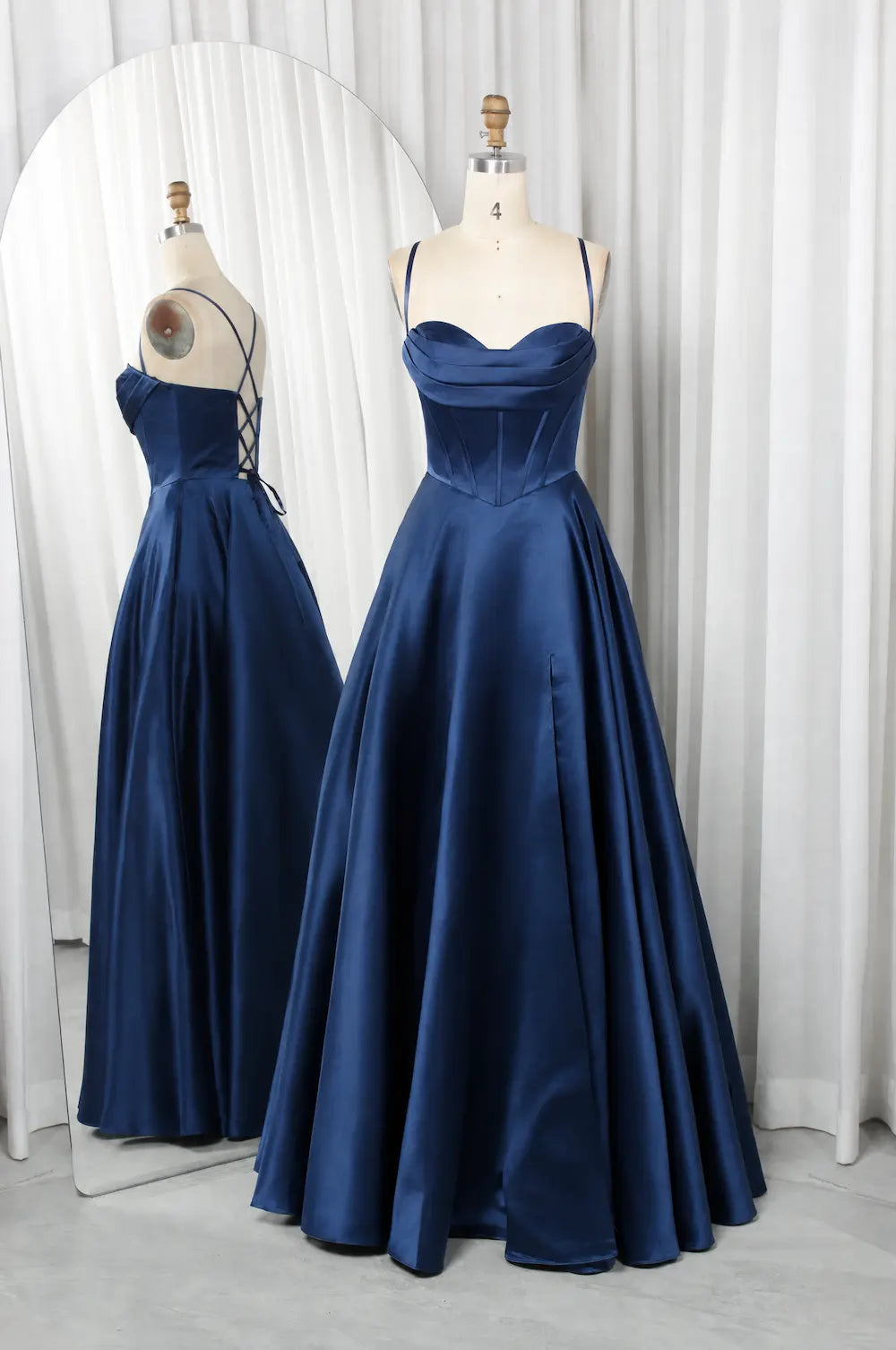Navy A-line prom dress with strapless sweetheart neckline and pleated full skirt