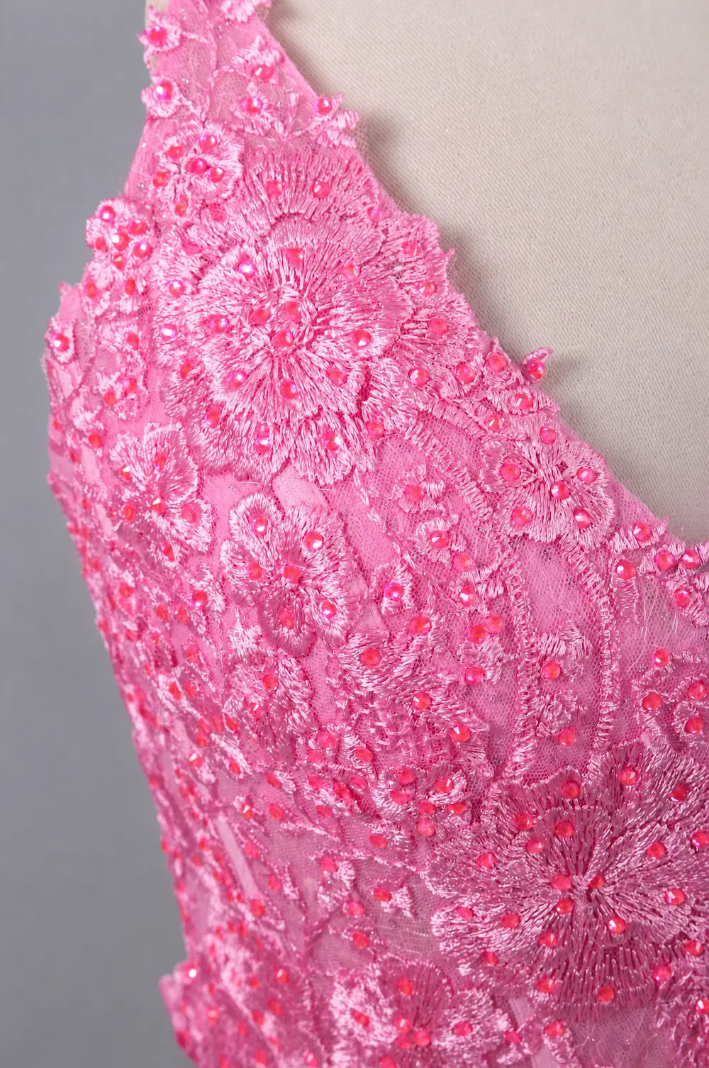 Pink rhinestone lace mermaid prom dress bodice with floral embellishment detail