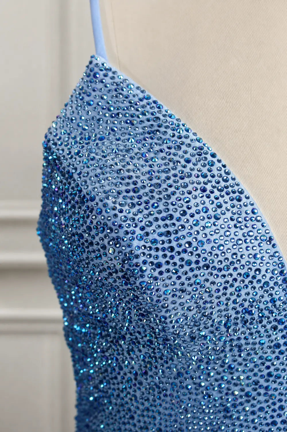 Blue rhinestone V-neck mermaid prom dress bodice with dense sparkling detail