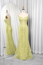 Light yellow mermaid corset prom dress with lace texture and thin straps