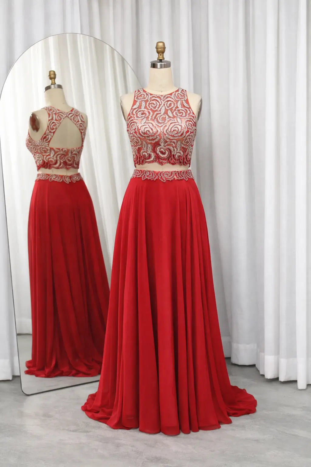 Red chiffon mother-of-the-bride dress with embroidered bodice and full pleated skirt