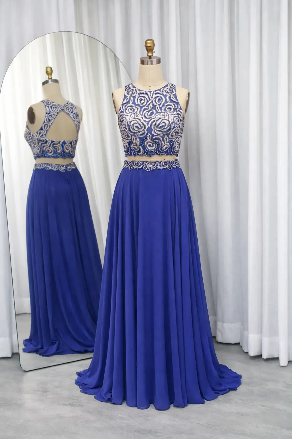 Royal blue chiffon mother-of-the-bride dress with embroidered high neckline bodice