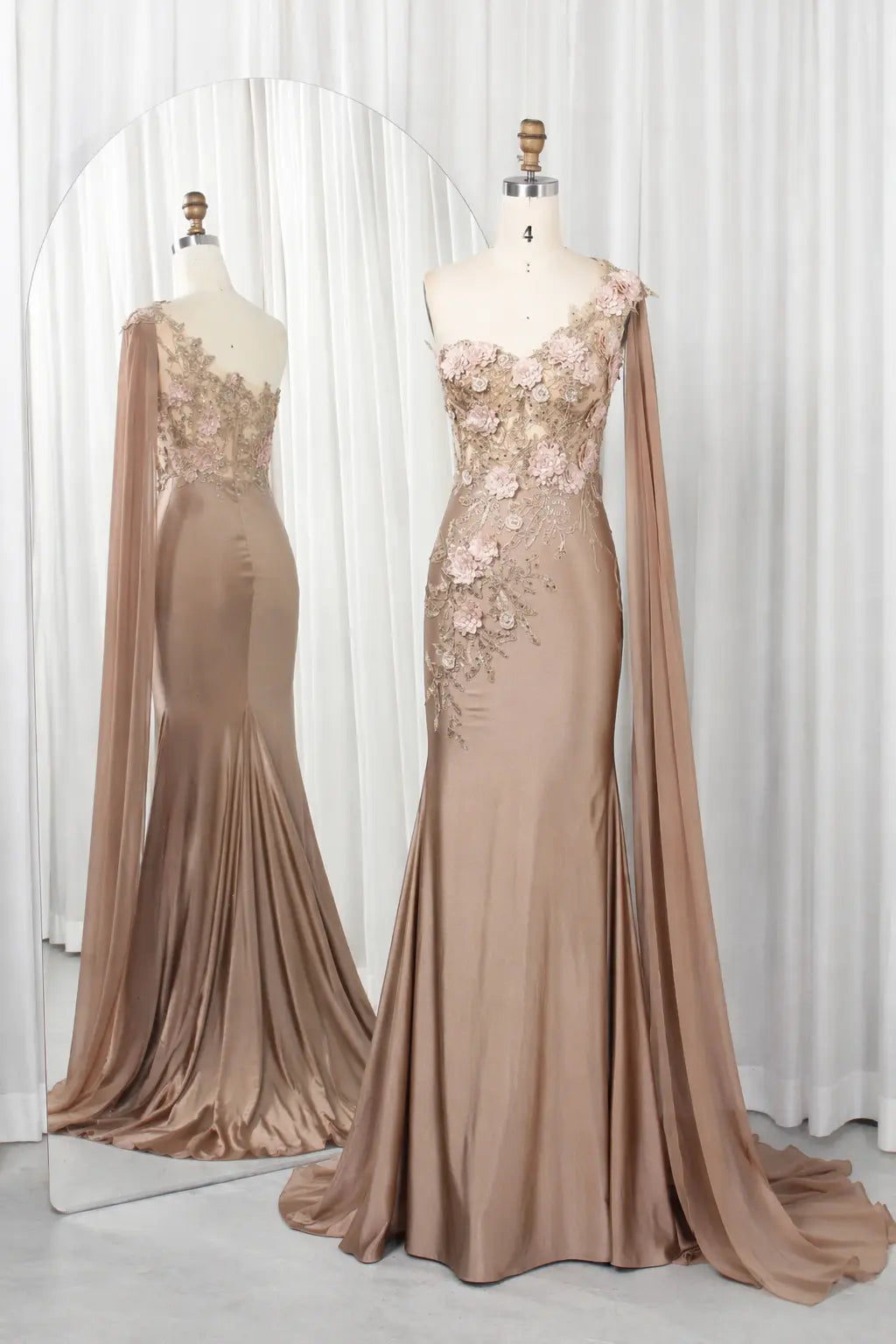 Champagne one-shoulder satin gown with 3D floral appliqués and draped sleeve