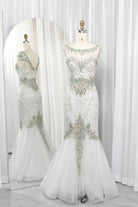 Sage mermaid mother-of-the-bride dress with illusion neckline and silver beaded details